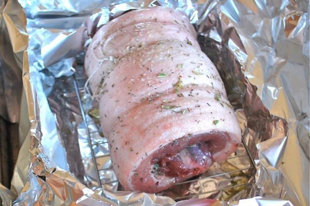 A top view of pork belly wrapped in foil