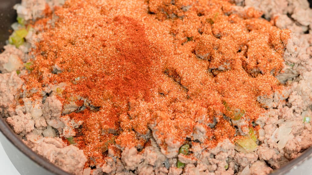 A view of ground meat topped with spices