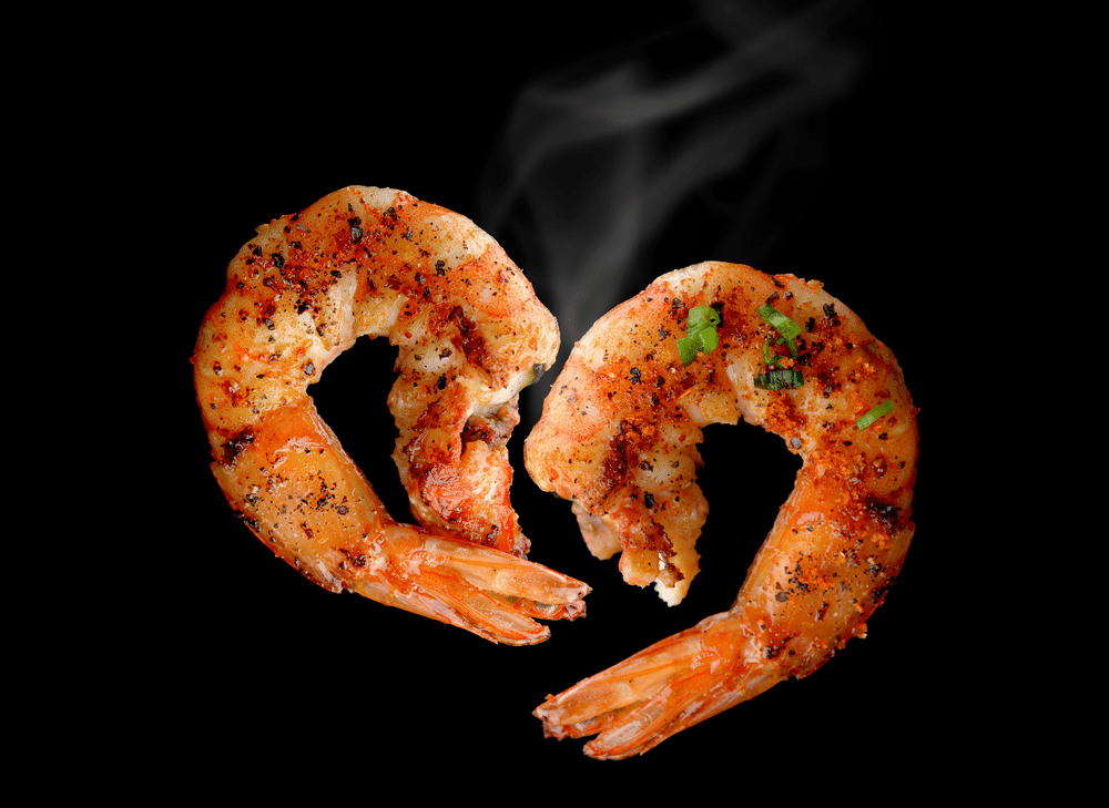 Grill Shrimp BBQ style mixed spicy ingredient set in black backgrount with smoke in studio lighting