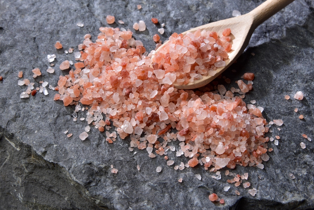 Himalayan Pink Salt In Crystals Above A Gray Stone