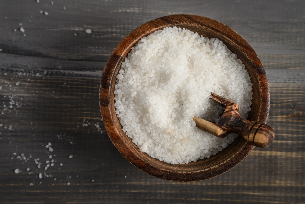 Kosher Salt In A Wooden Bowl With A Wooden Spoon