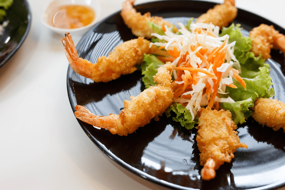 fried shrimp tempura with vegetables on plate