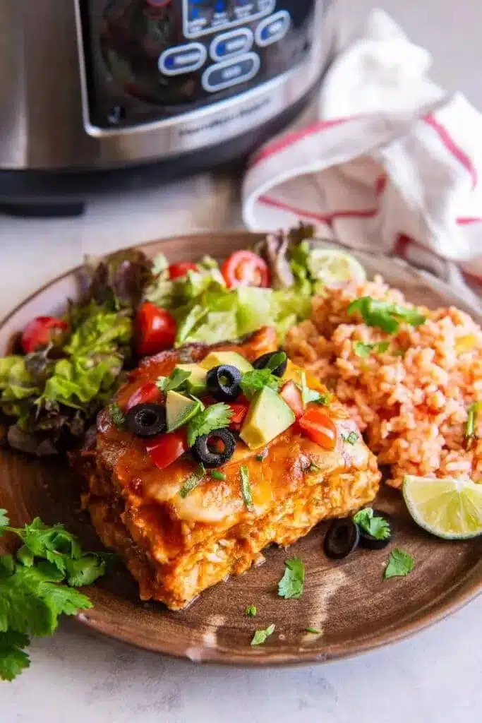 slow cooker chicken enchiladas served in a plate