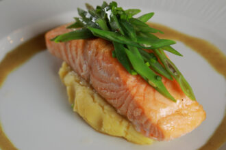 Slow Cooked Salmon Was Served On A White Plate Selective