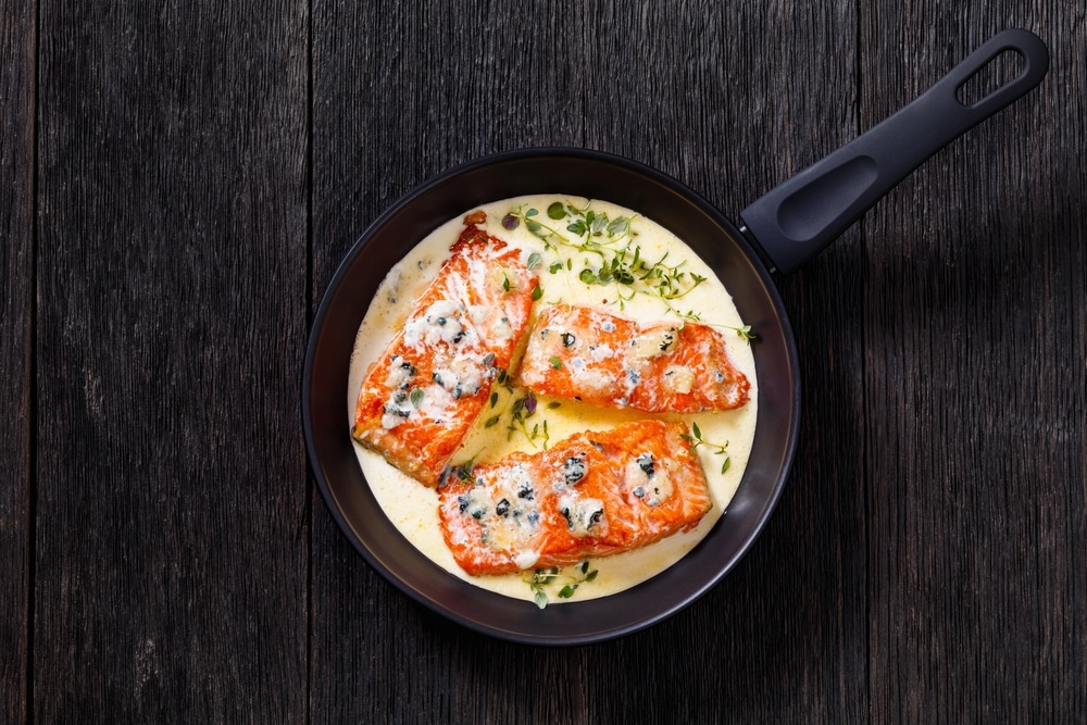 Salmon Fillet Cooked With Creamy Blue Mold Cheese Sauce In