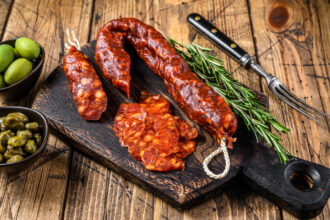 Spanish Traditional Tapas Sliced Chorizo Salami Chorizo Sausage Wooden Background