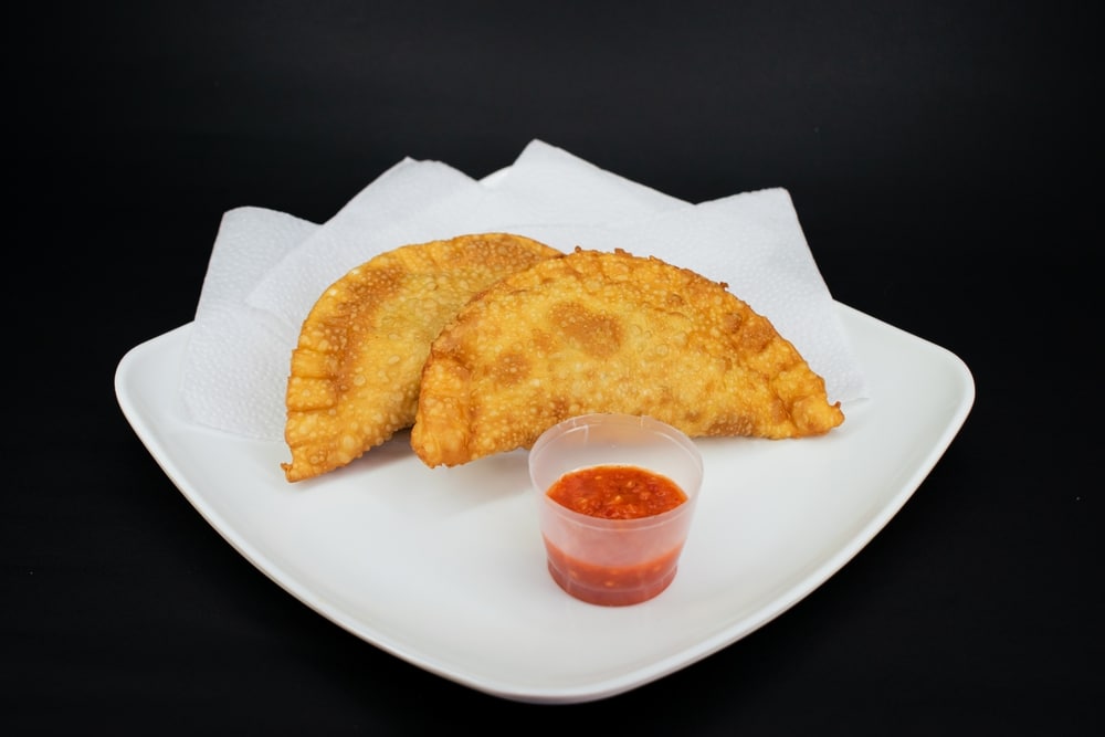 Empanada With Chili On A Table With Black Background