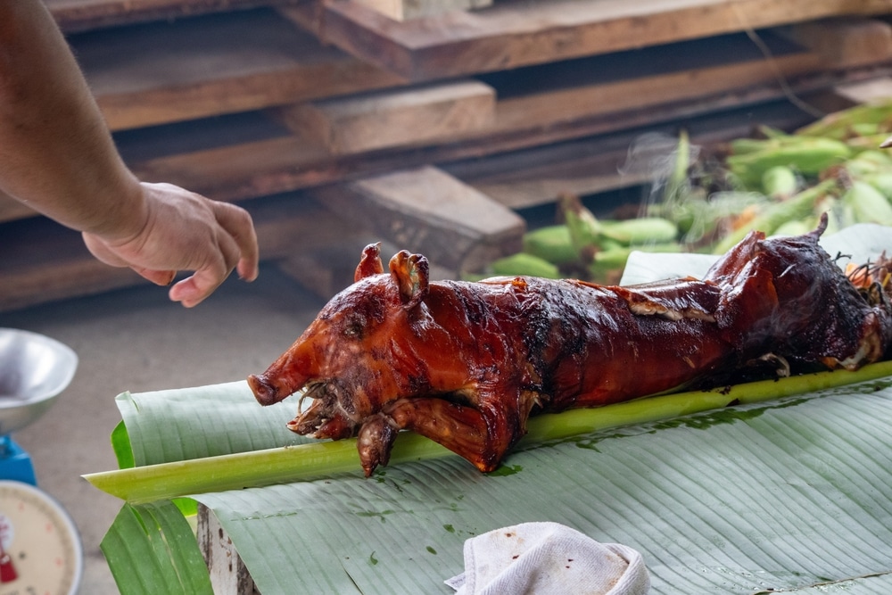 Spit roasted Lechon On A Banana Leaf Outside Of Cebu In