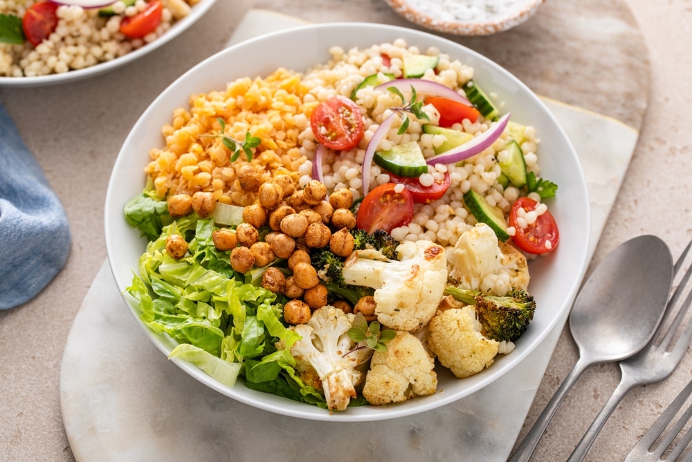 A view of a quinua bowl with roasted veggies